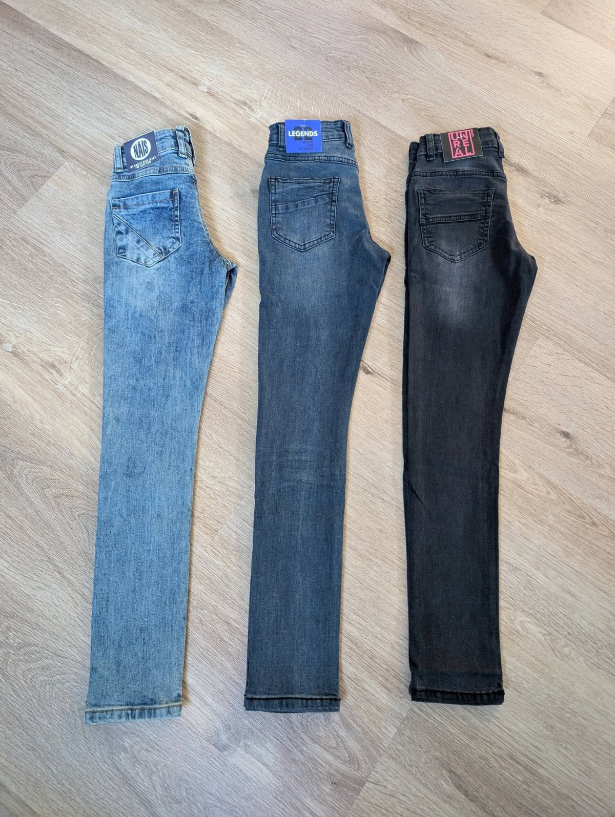 The three available jeans washes shown side by side: light, mid and dark