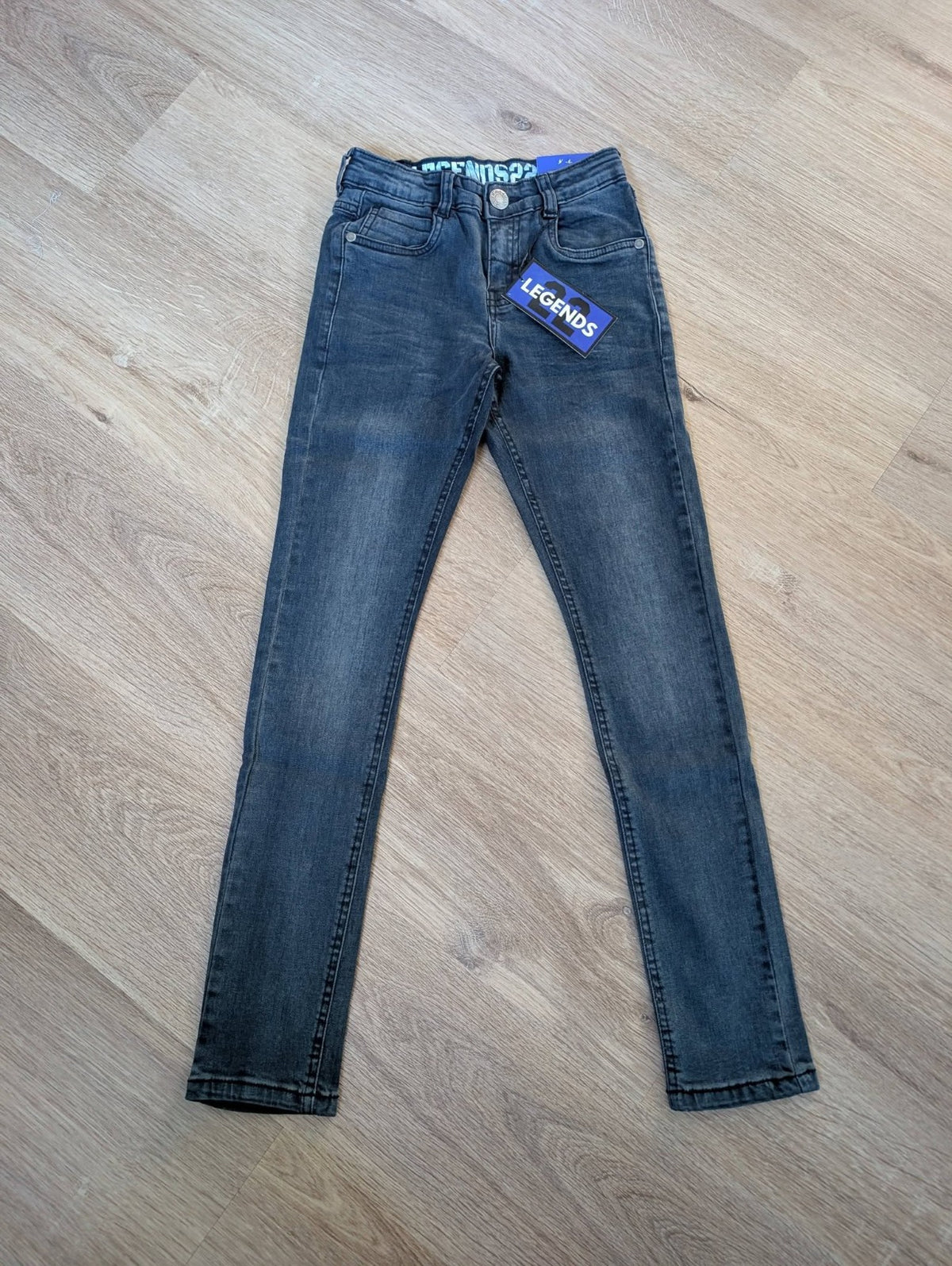 Legends22 boys' mid-blue stretch skinny jeans, laid flat