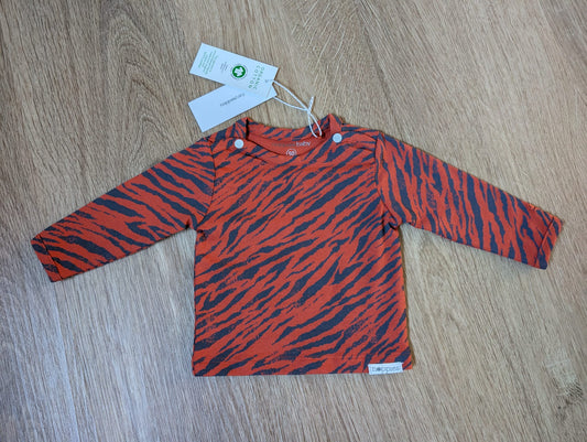 Noppies rust orange long-sleeve baby shirt with black tiger stripe print, EU size 50